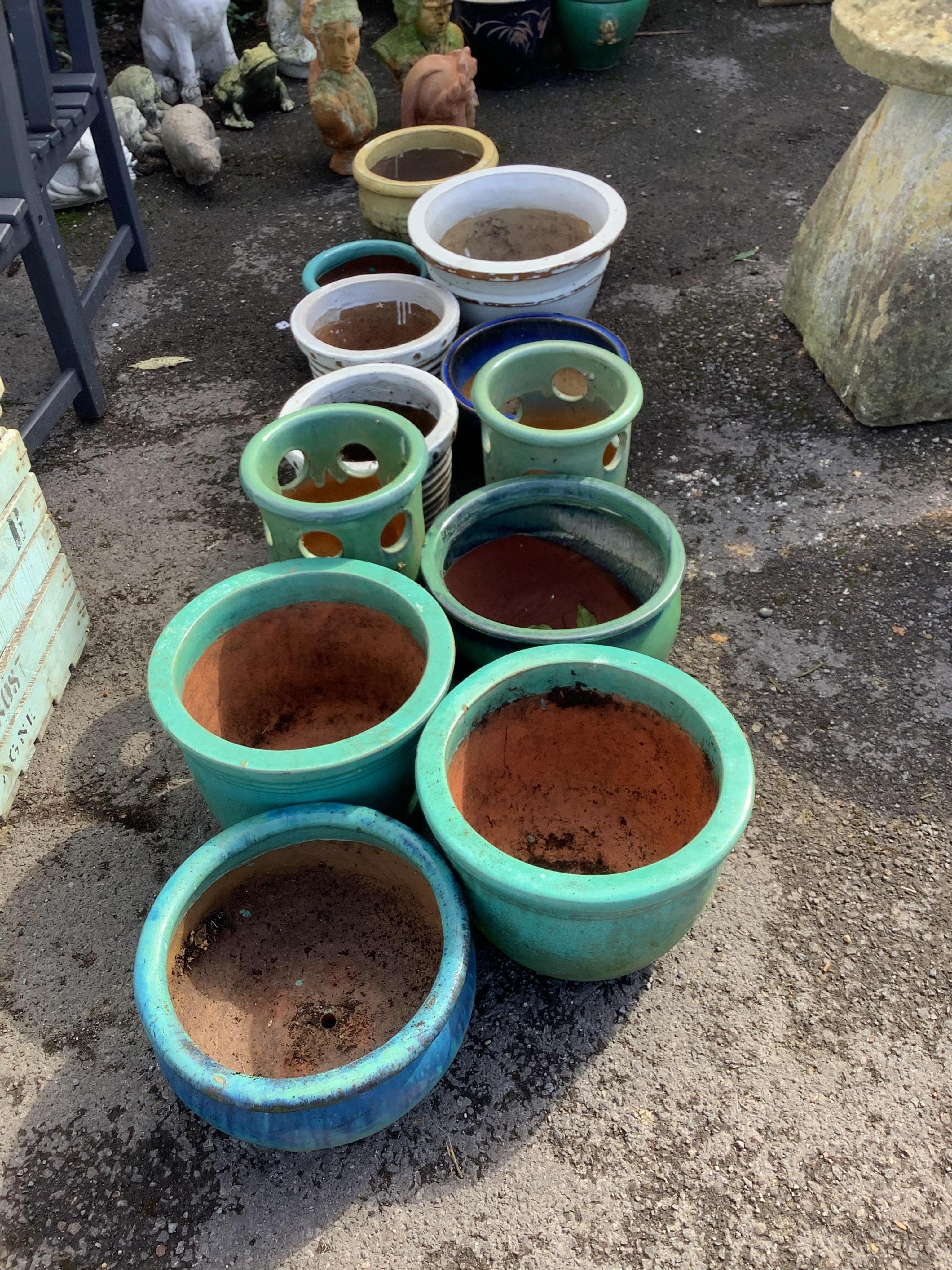 A collection of assorted glazed pottery garden pots and ornaments, largest diameter 42cm. Condition - all used and weathered but essentially fair